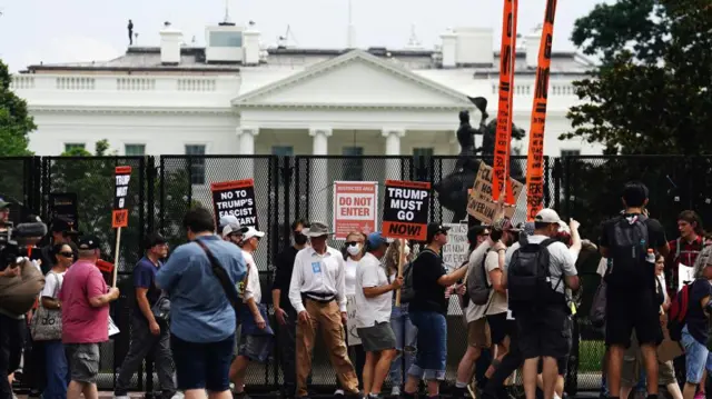 People participate in a 'No Kings' protest outside the White House