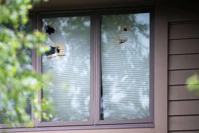 Damage is seen outside Minnesota Representative Melissa Hortman's home, where she was shot and killed