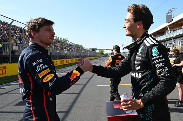 Max Verstappen and George Russell shake hands after qualifying