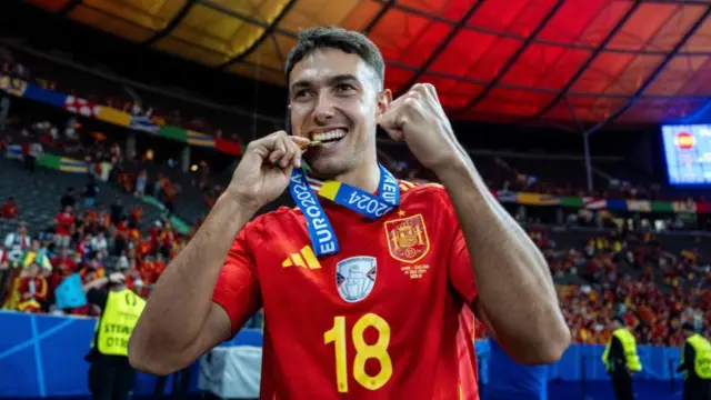 Martin Zubimendi of Spain celebrates with a medal