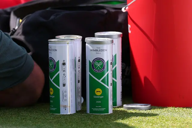 Cans of tennis balls on the grass