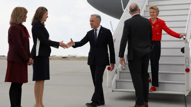 Mark Carney stepping off a plane