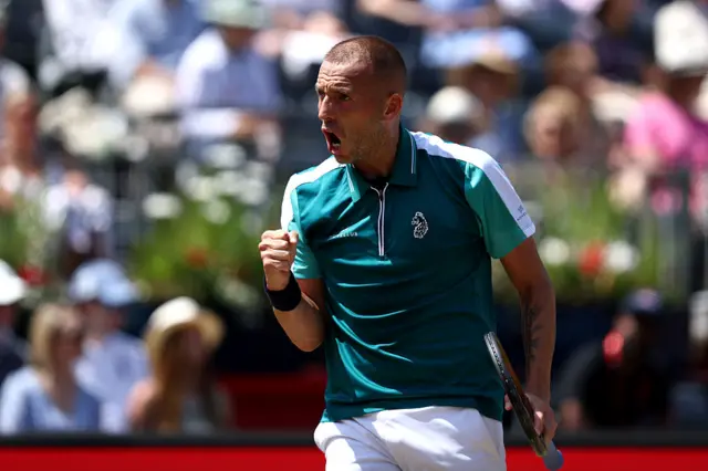 Dan Evans holds up his fist
