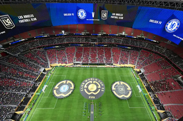 Aerial view as players walk out onto the pitch as the stands sit mostly empty