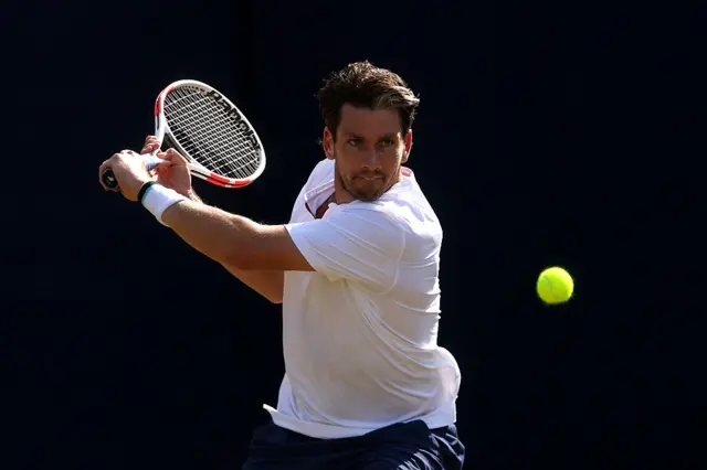 Cameron Norrie hits a tennis ball