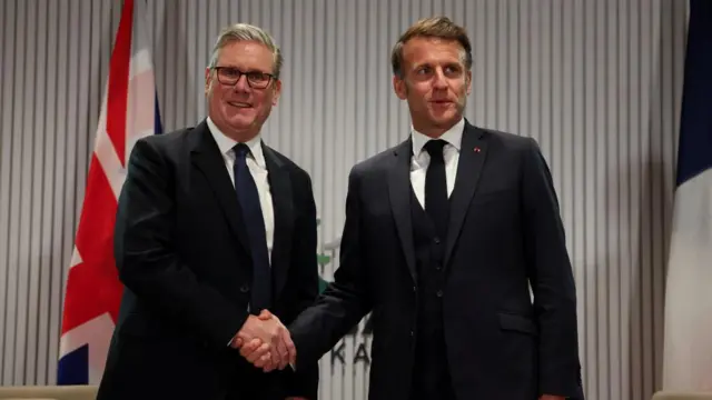Prime Minister Sir Keir Starmer shakes hands with France's President Emmanuel Macron during a bilateral meeting at the G7 summit leaders' in Kananaskis, Alberta, Canada