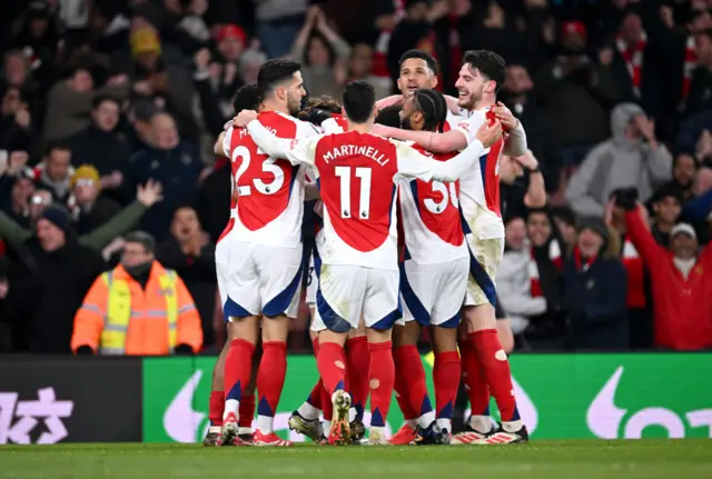 Ethan Nwaneri of Arsenal celebrates scoring his team's fifth goal with teammates