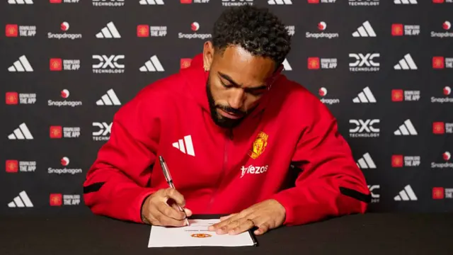 Matheus Cunha of Manchester United signing his contract with the club