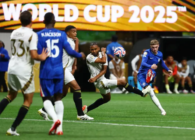 Palmer curls a shot around a defender towards the top corner