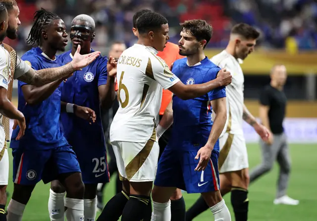 Players of both teams clash before half time after a bad tackle