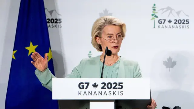 European Commission President Ursula von der Leyen speaks from a podium.