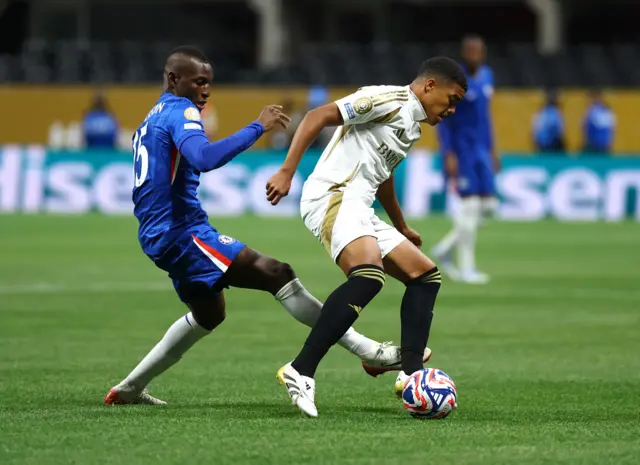 Jackson tries to win the ball back for Chelsea