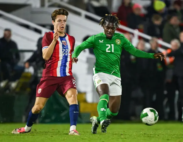 Baba Adeeko of Republic of Ireland in action against Sverre Nypan of Norway