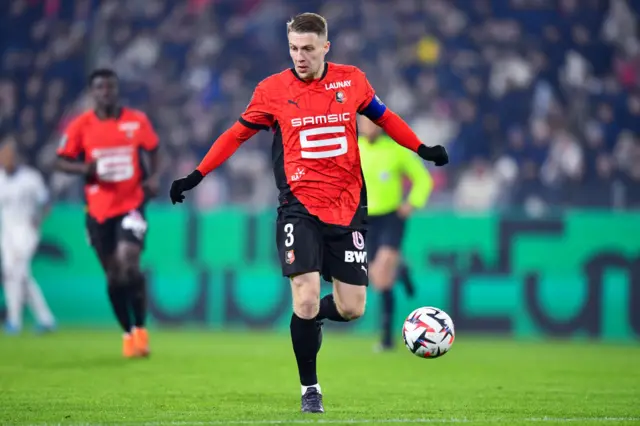 Adrien Truffert of Stade Rennais controls the ball
