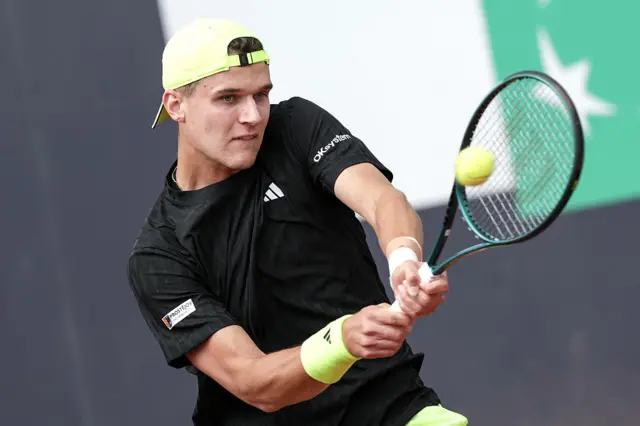 Jakub Mensik hits a tennis ball