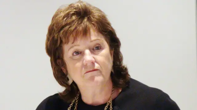 Professor Alexis Jay during a 2014 press conference in Rotherham.  She has brown hair and is wearing a black top with gold chain necklace.
