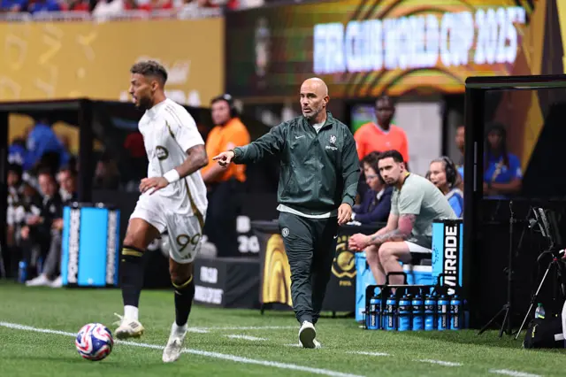 Bounga dribbles down the wing as Maresca watches on