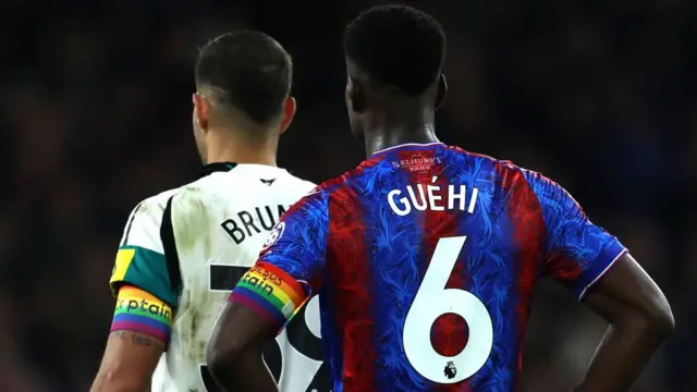 Bruno Guimaraes of Newcastle United and Marc Guehi of Crystal Palace