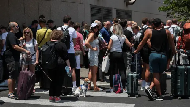 People with foreign nationalities gather to leave Israel on buses via Egypt, following a missile attack from Iran, in Tel Aviv, Israel, June 17, 2025.