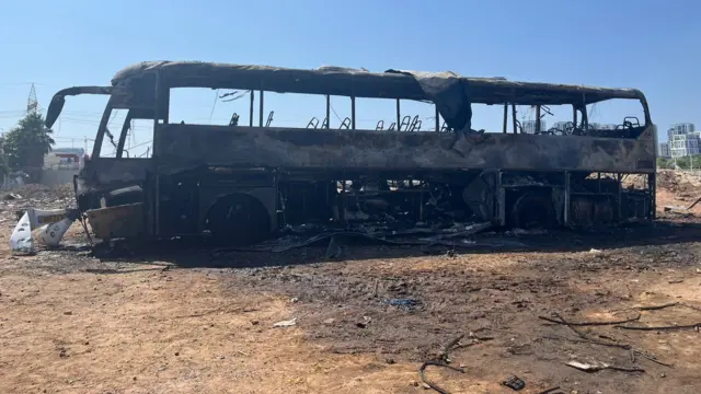 The shell of a burned-out bus