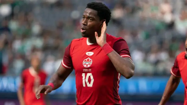 Jonathan David of Canada celebrates after scoring