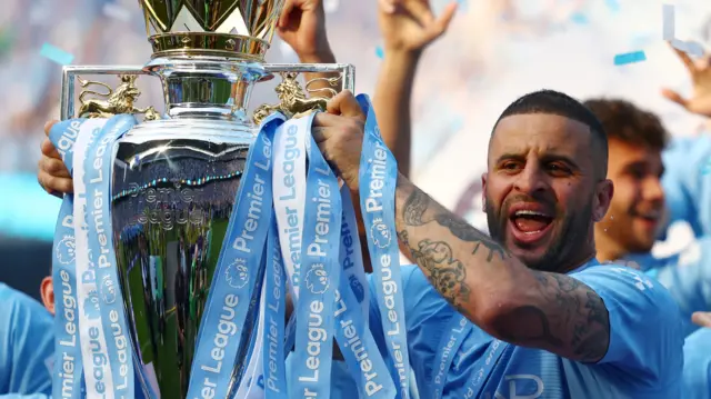 Kyle Walker with the Premier League trophy in 2024