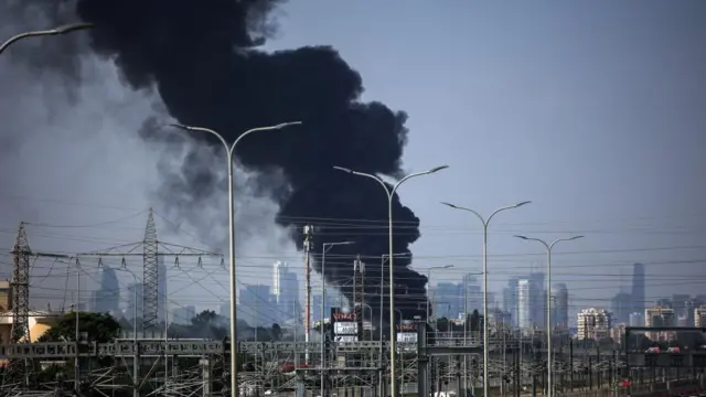 Smoke rises following a missile attack from Iran, in Herzliya, Israel, 17 June 2025