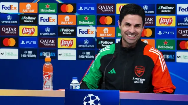 Arsenal's Spanish coach Mikel Arteta smiles during a press conference
