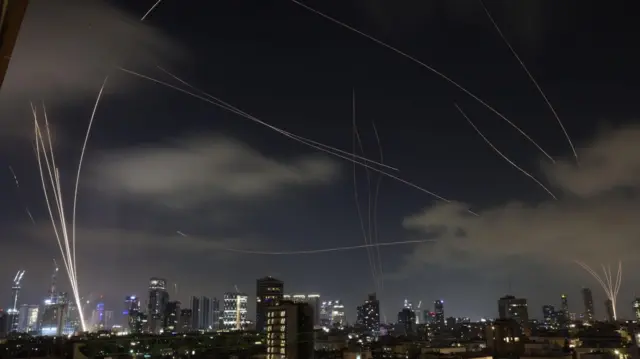 Israeli air defences intercepting Iranian missiles above Tel Aviv, Israel.