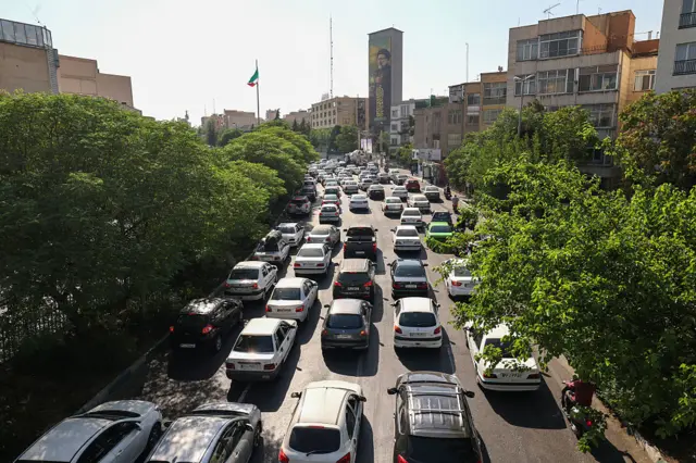 Cars seen queueing on the roads out of Tehran