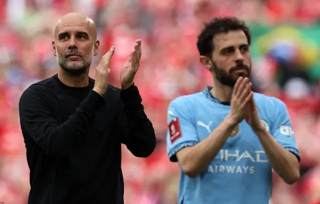 Manchester City's Spanish manager Pep Guardiola (L) and Manchester City's Portuguese midfielder #20 Bernardo Silva applauds the fans