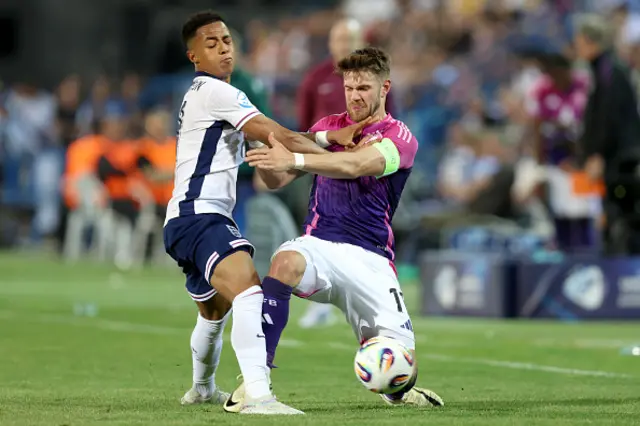 Omari Giraud-Hutchinson of England competes for the ball with Jan Thielmann
