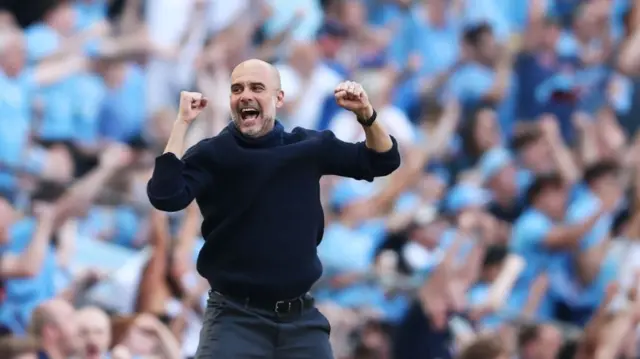Pep Guardiola, Manager of Manchester City, celebrates