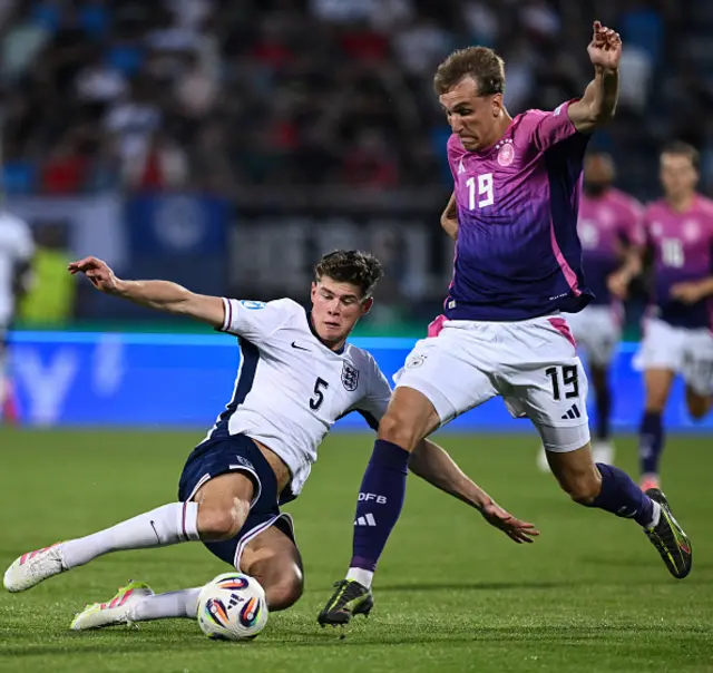 Nelson Weiper of Germany competes for the ball with Charlie Cresswell