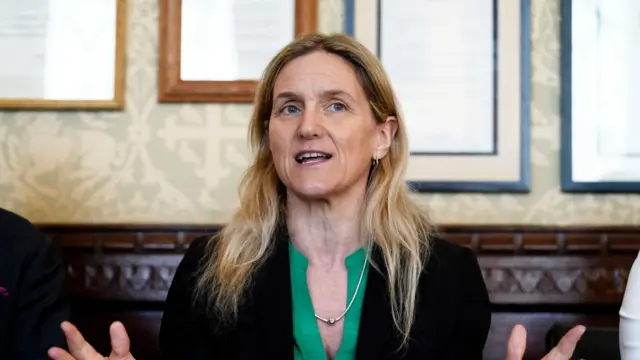 Labour MP Kim Leadbeater speaks wearing a green top and black blazer.