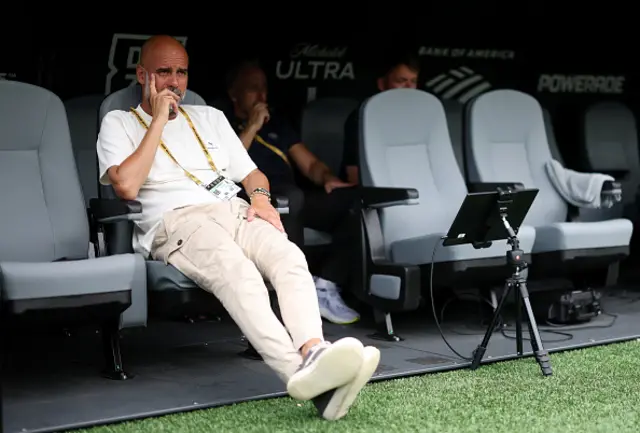 Pep Guardiola, Head Coach of Manchester City, looks on