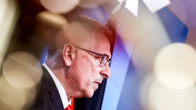 Israeli foreign minister Gideon Sa'ar wears a suit as he looks right out of frame.