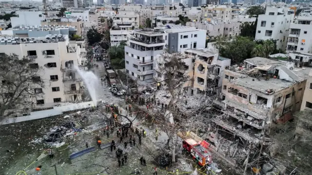 A drone photo shows the damage over residential homes at the impact site following missile attack from Iran on Israel