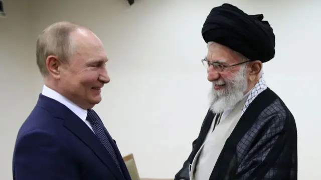 Iranian supreme leader Ayatollah Ali Khamenei greets Russian President Vladimir Putin