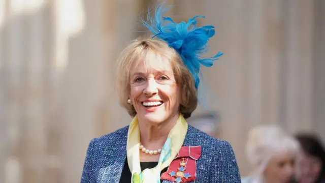 Dame Esther Rantzen smiles.