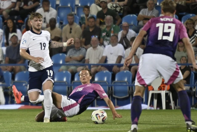 Germany's Caspar Jander in action with England's Harvey Elliott