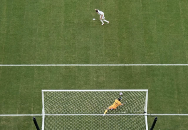 Al Hilal's Yassine Bounou saves a penalty from Real Madrid's Federico Valverde