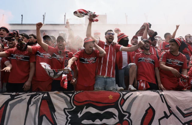 Wydad Casablanca fans with flares in the stands