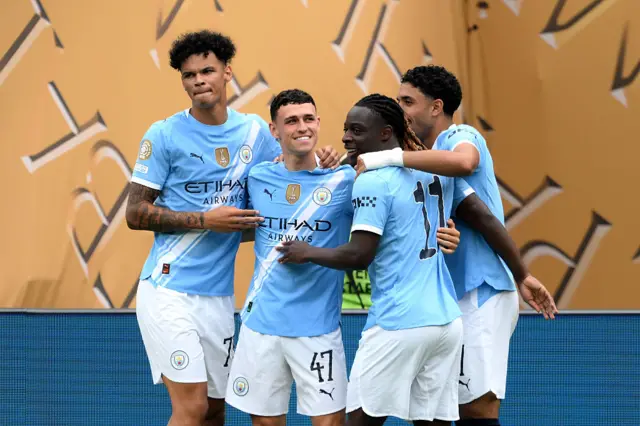 Phil Foden with Manchester City team-mates
