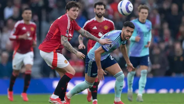 Mikel Merino of Arsenal and Victor Lindelof of Manchester United in action