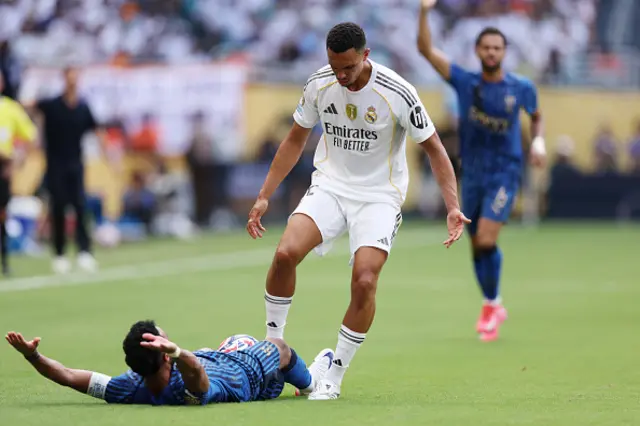 Trent Alexander-Arnold #12 of Real Madrid C.F. stands over Salem Aldawsari
