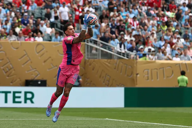 Ederson jumps to save the ball