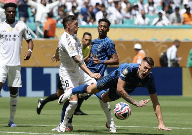 Real Madrid's Federico Valverde in action with Al Hilal's Sergej Milinkovic-Savic