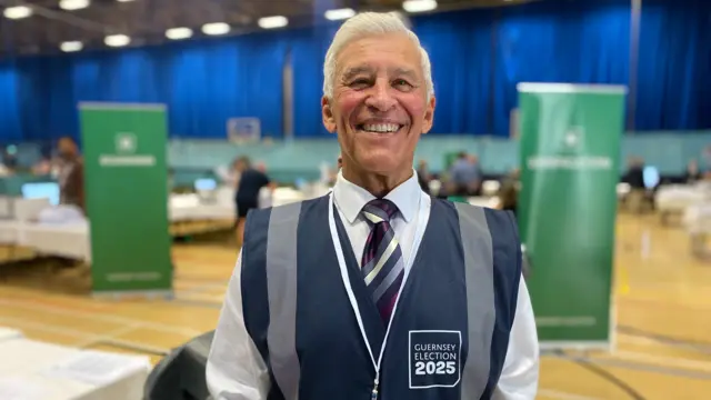 Keith Bell stood in his official uniform in the counting room.