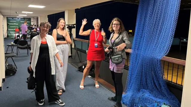 A number of candidates standing on a concourse at Beau Sejour